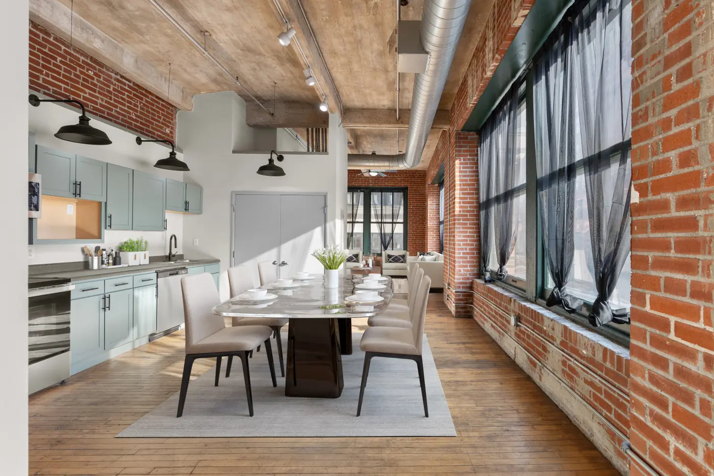 Open kitchen and dining area beneath original timber ceilings